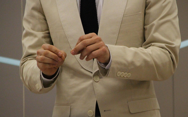 Man wearing a beige blazer